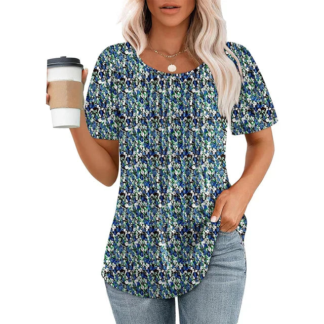 Women's white lightweight pleated blouse with round neckline, airy summer style and everyday chic silhouette