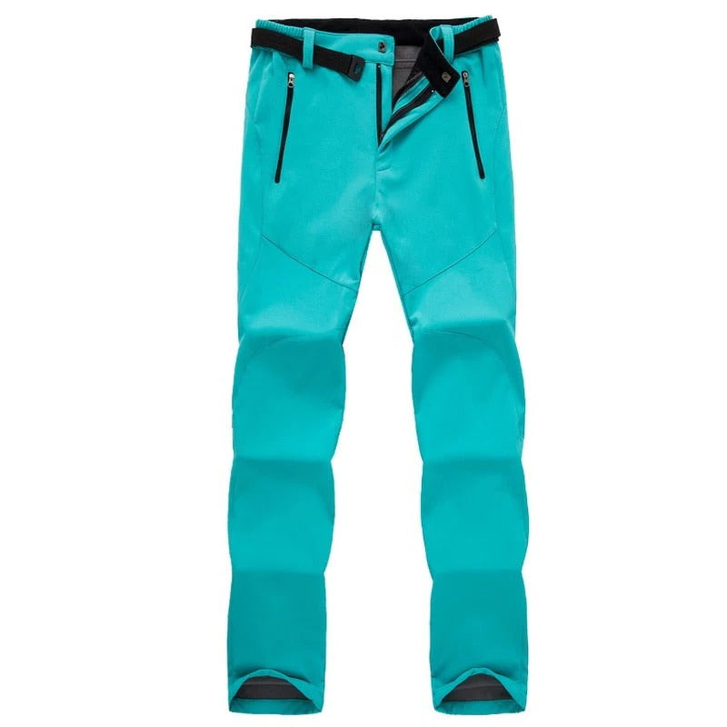 Women's weather-resistant hiking pants in neutral stretch fit with insulated soft lining for outdoor trekking