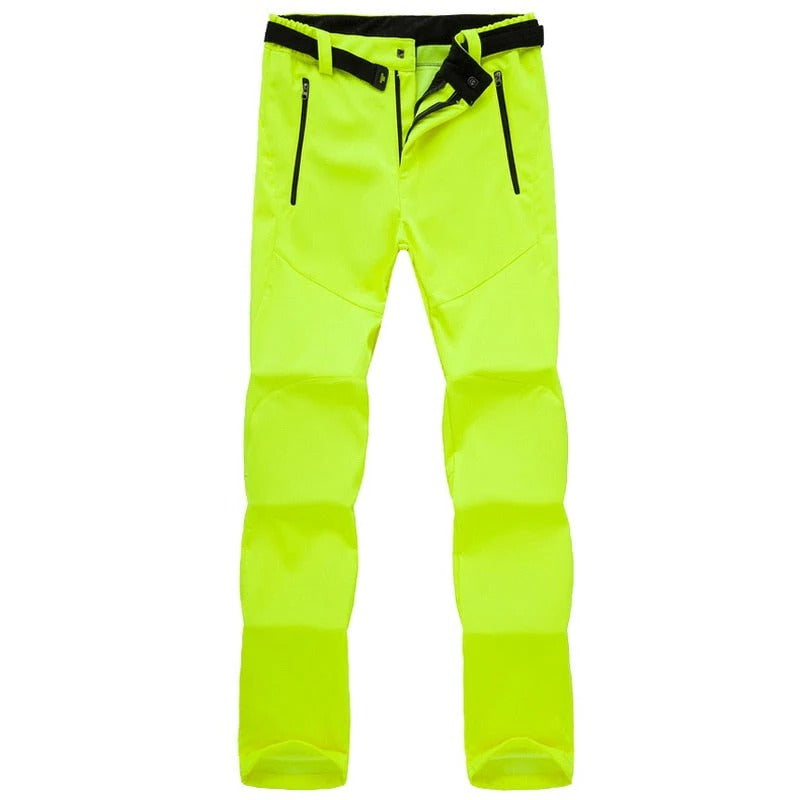 Women's weather-resistant hiking pants in neutral tone, slim athletic cut with durable stretch lining