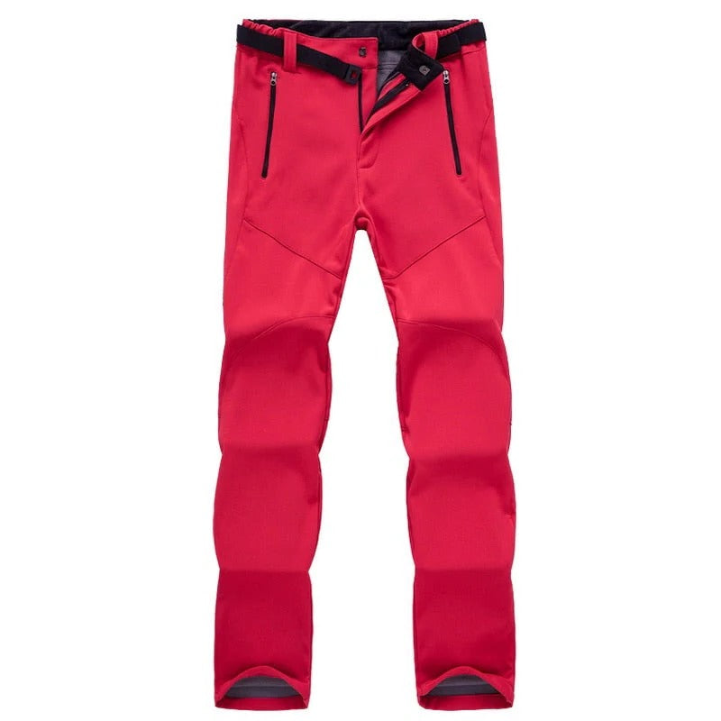 Women's weather-resistant stretch hiking pants in neutral tones with soft insulating lining for outdoor trekking