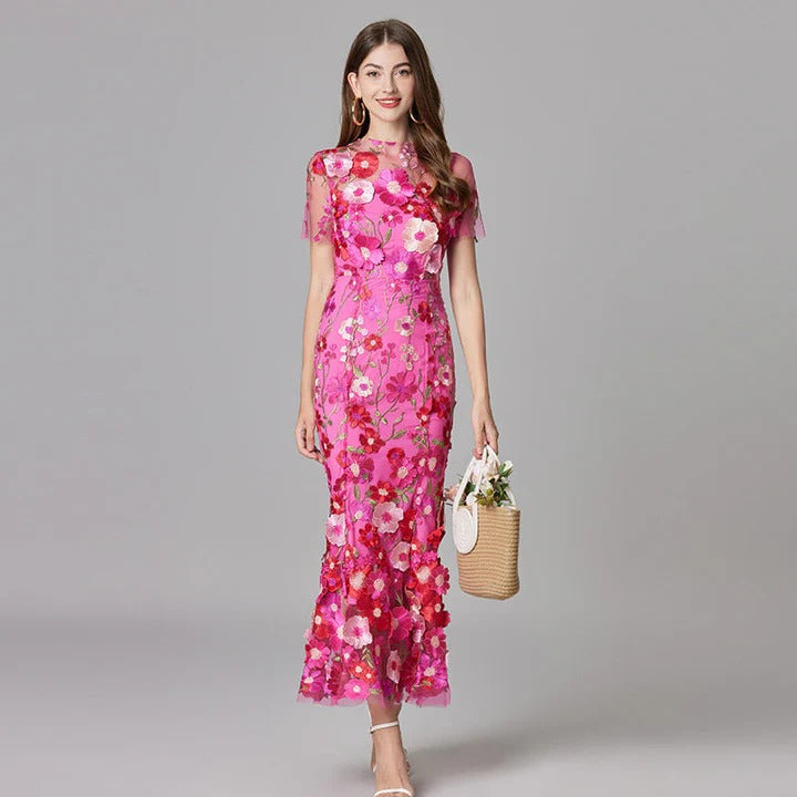 Women's sleeveless floral midi dress in vibrant print, elegant flowing silhouette for weddings and garden events