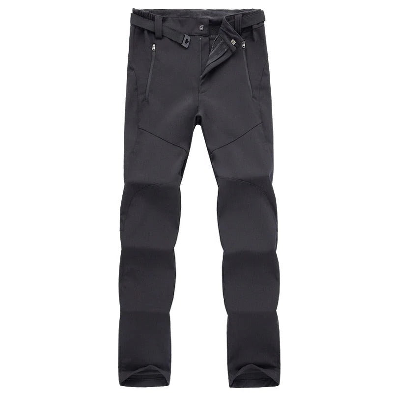 Women's weather-resistant hiking pants in neutral tone, slim athletic cut with durable stretch for outdoor trekking
