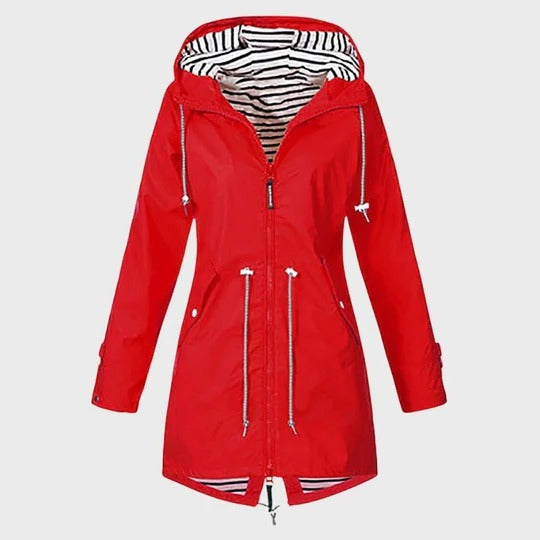 Women's long waterproof hooded rain jacket in neutral tone, slim silhouette with adjustable hood