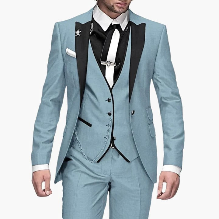 Men's burgundy three-piece tailored suit with black lapels, jacket vest trousers, wedding guest formal wear