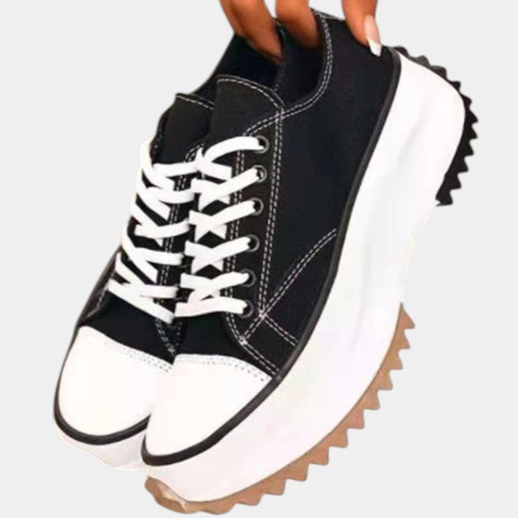 White canvas platform lace-up sneakers with chunky thick sole and rounded contrast toe