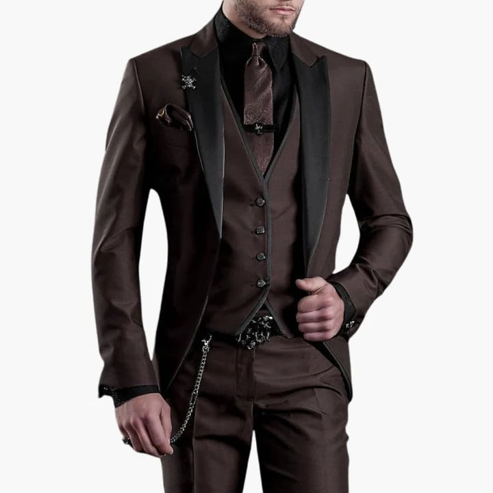 Men's burgundy three-piece tailored suit with black contrast lapels, perfect for weddings