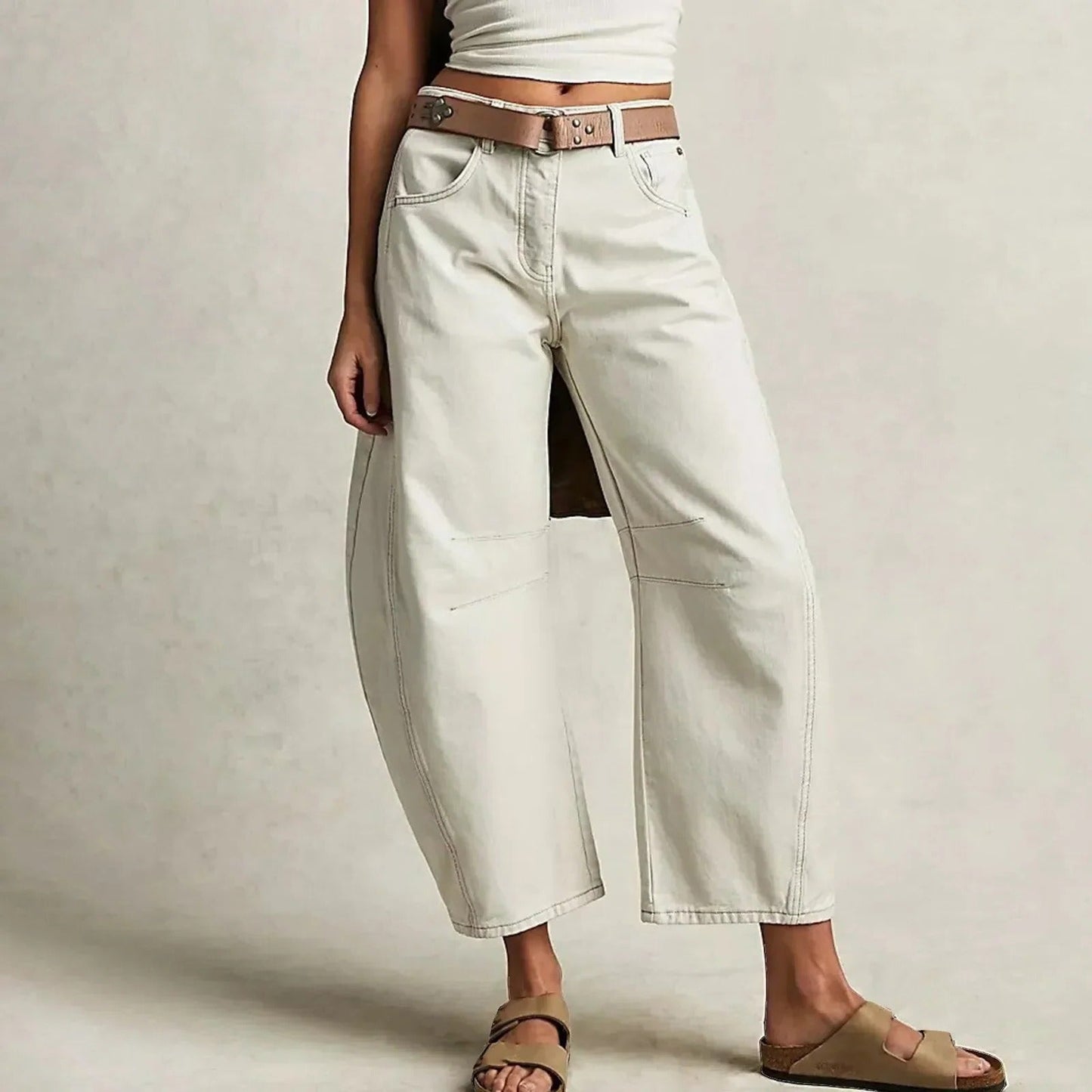 Wide-leg relaxed fit jeans in classic blue denim with structured waistband for everyday versatile style