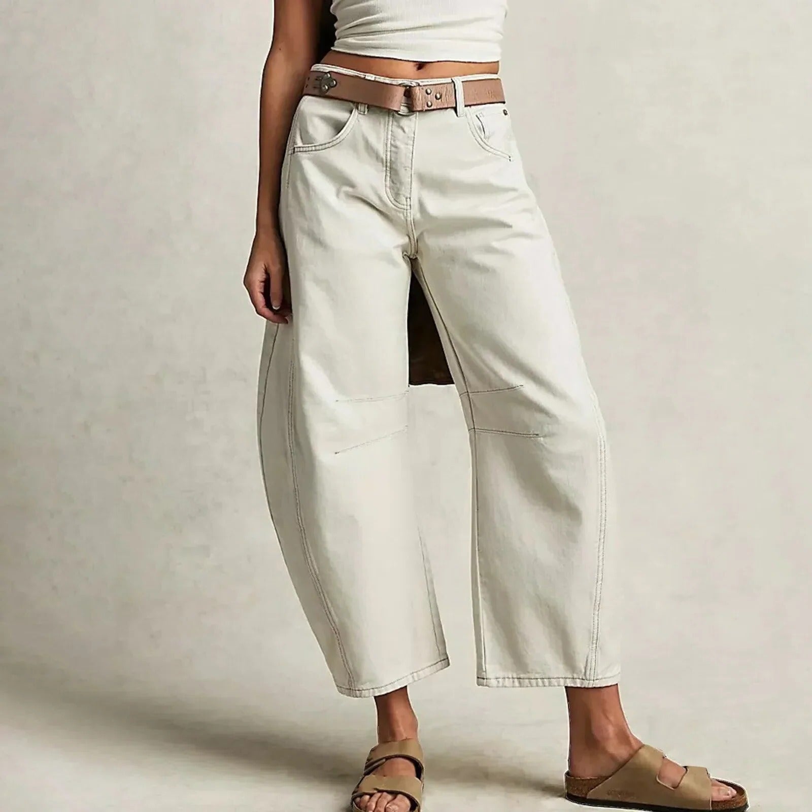 Wide-leg relaxed fit jeans in classic blue denim with structured waistband for everyday versatile style