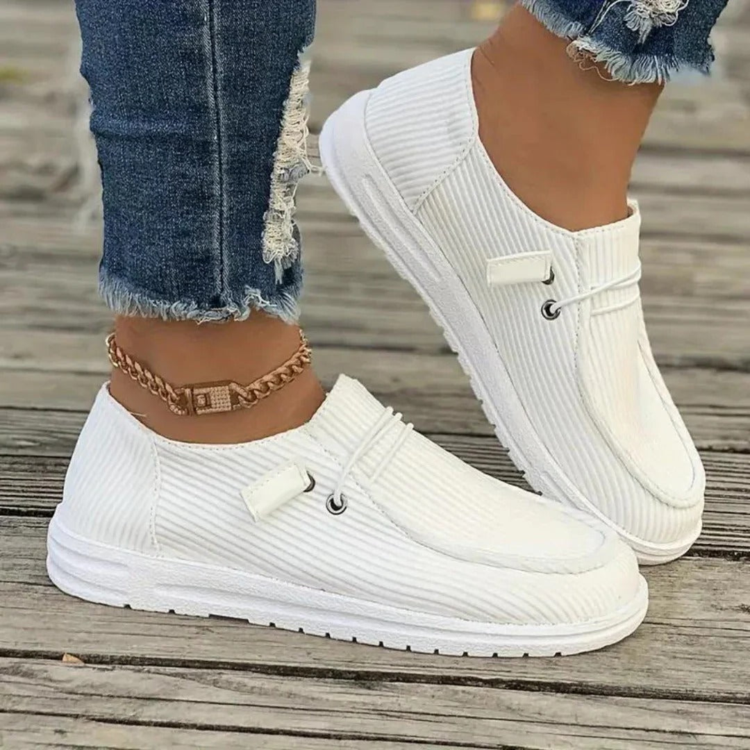 Women's slip-on hiking boots in neutral tones, laceless outdoor style with cushioned support for all-day comfort