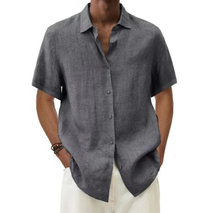 Men's beige linen relaxed-fit short-sleeve button-down shirt with clean polished silhouette