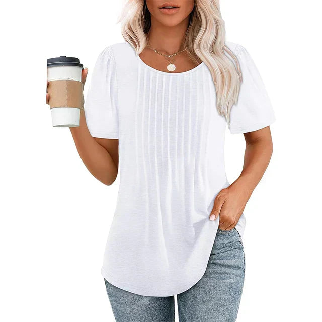 Women's lightweight summer blouse with soft crew neckline, pleated details, and airy breathable fabric for everyday chic