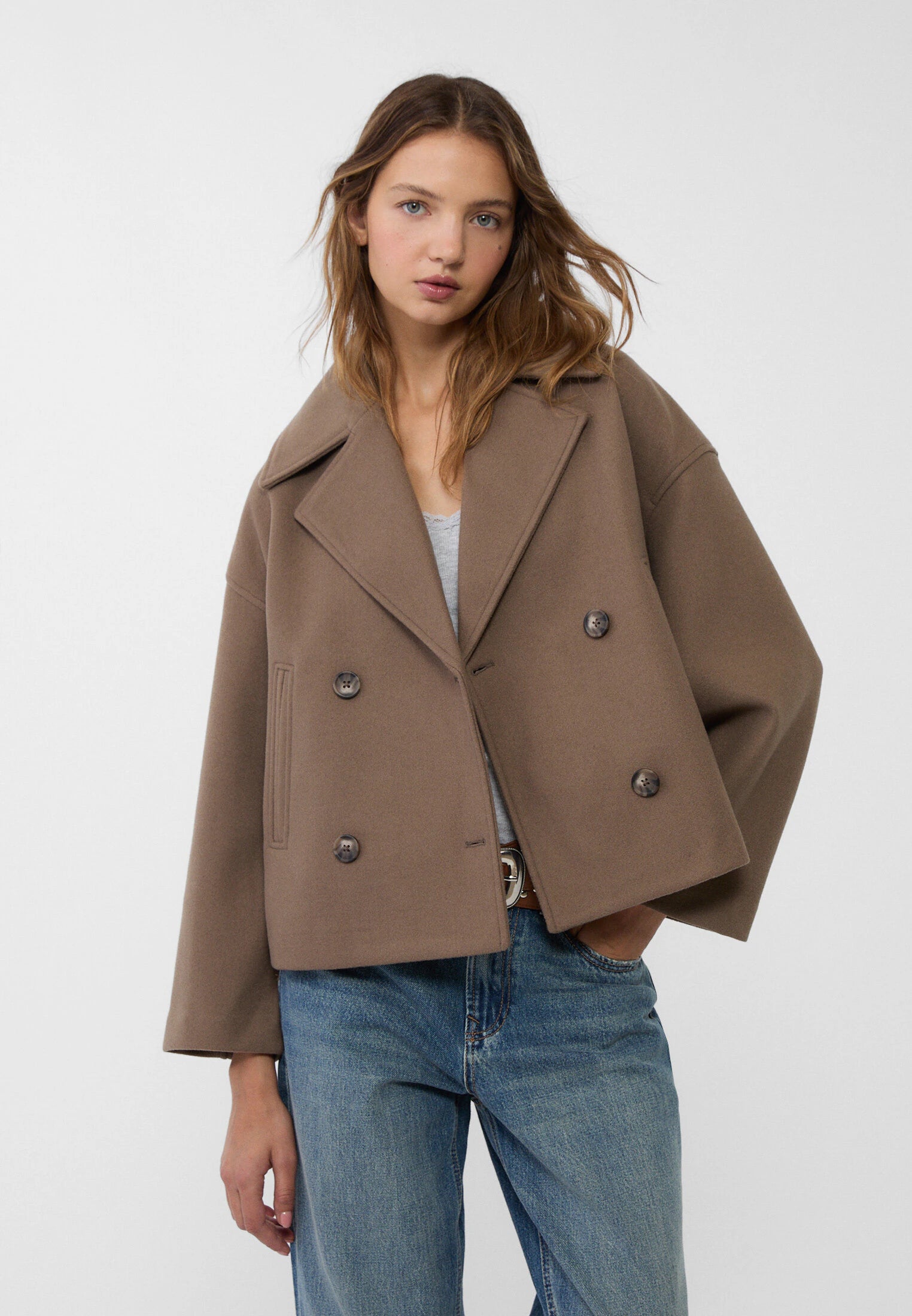 Women's cropped double-breasted peacoat wide lapels structured modern silhouette effortless layering