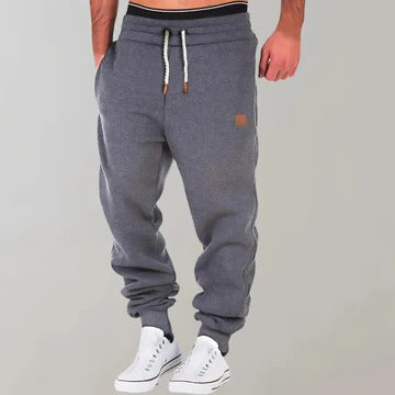 Men's gray relaxed-fit jogger pants with breathable fabric for gym and casual everyday wear