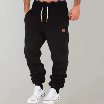 Men's gray relaxed-fit jogging pants with breathable fabric for gym and casual everyday wear