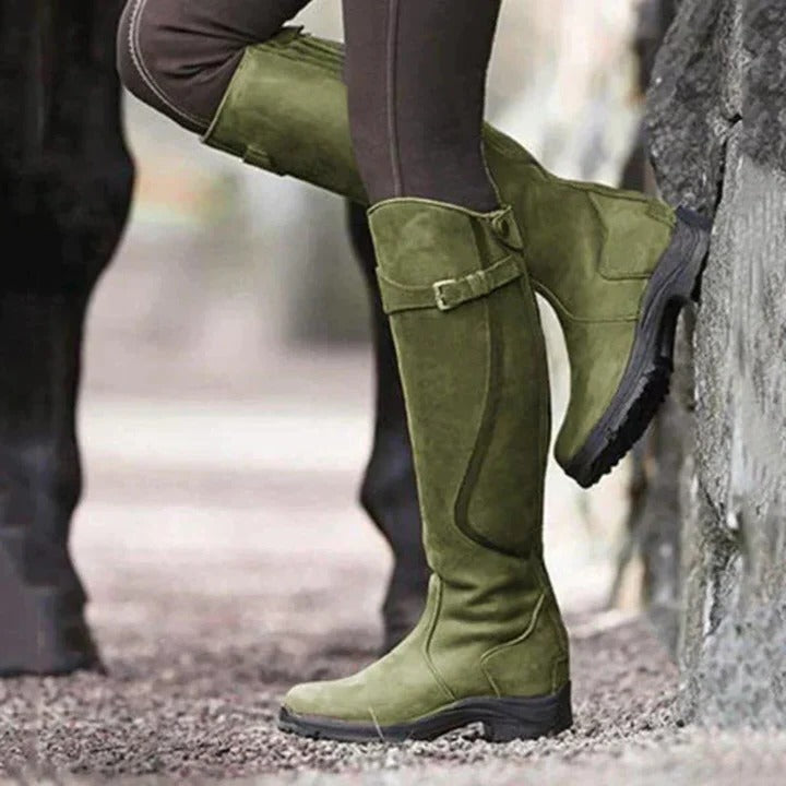 Women's black high-top waterproof boots with minimalist silhouette and ankle-elevating all-weather design