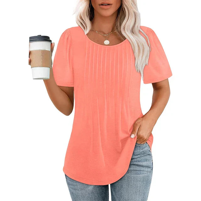 Lightweight white pleated blouse with soft crew neckline, airy summer silhouette for women