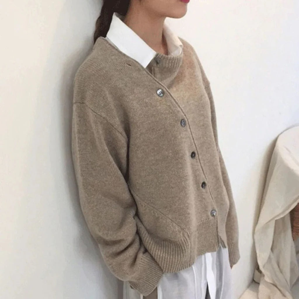 Women's mid-weight wrap jacket with asymmetrical button closure, clean structured silhouette