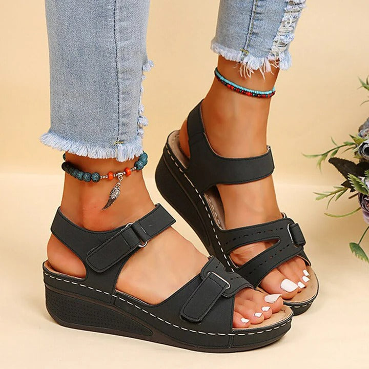 Beige open-toe adjustable strap sandals with cushioned sole for everyday comfort and support