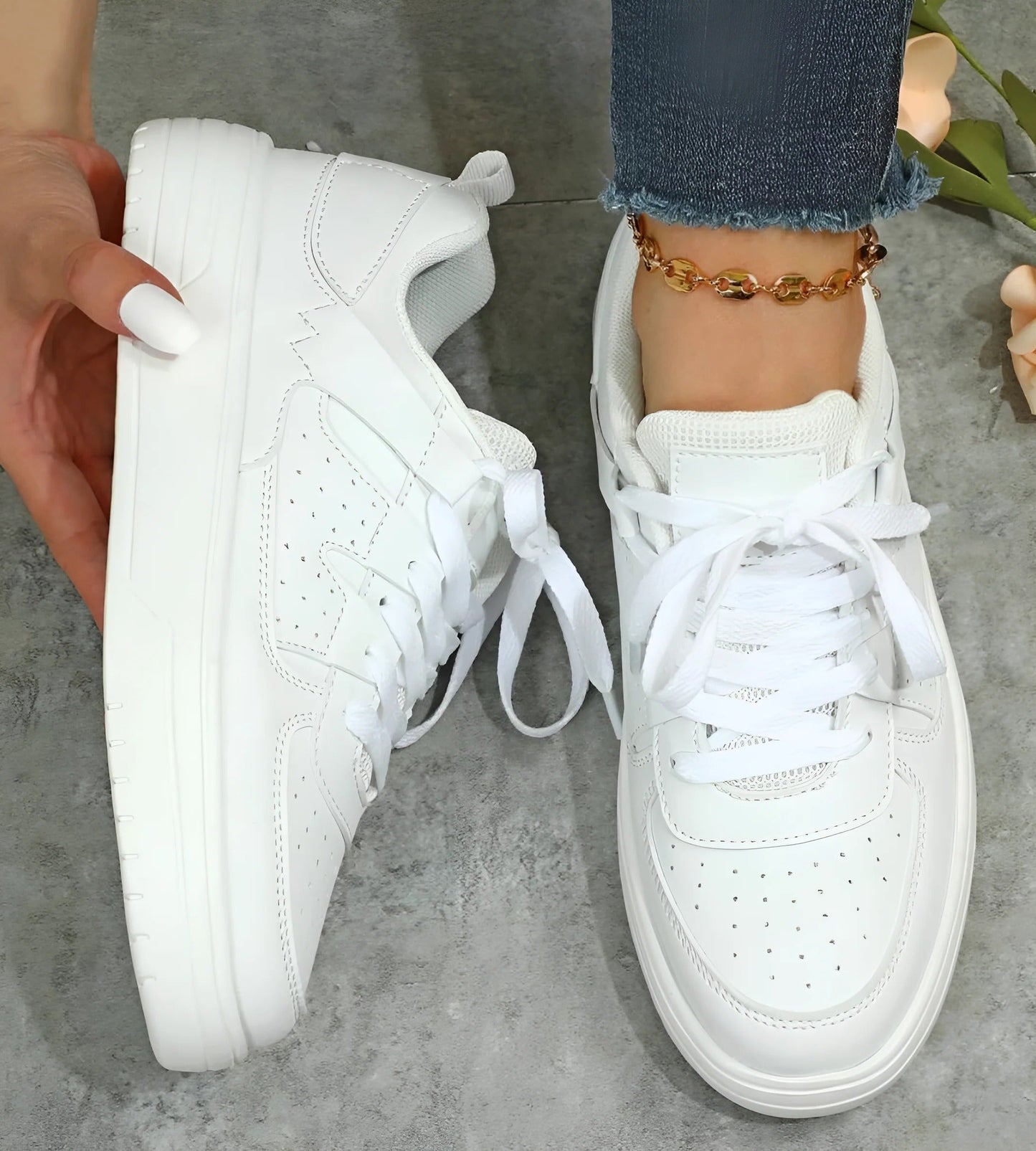 Women's low-cut lace-up sneakers in clean neutral tones, streamlined silhouette for all-day everyday comfort