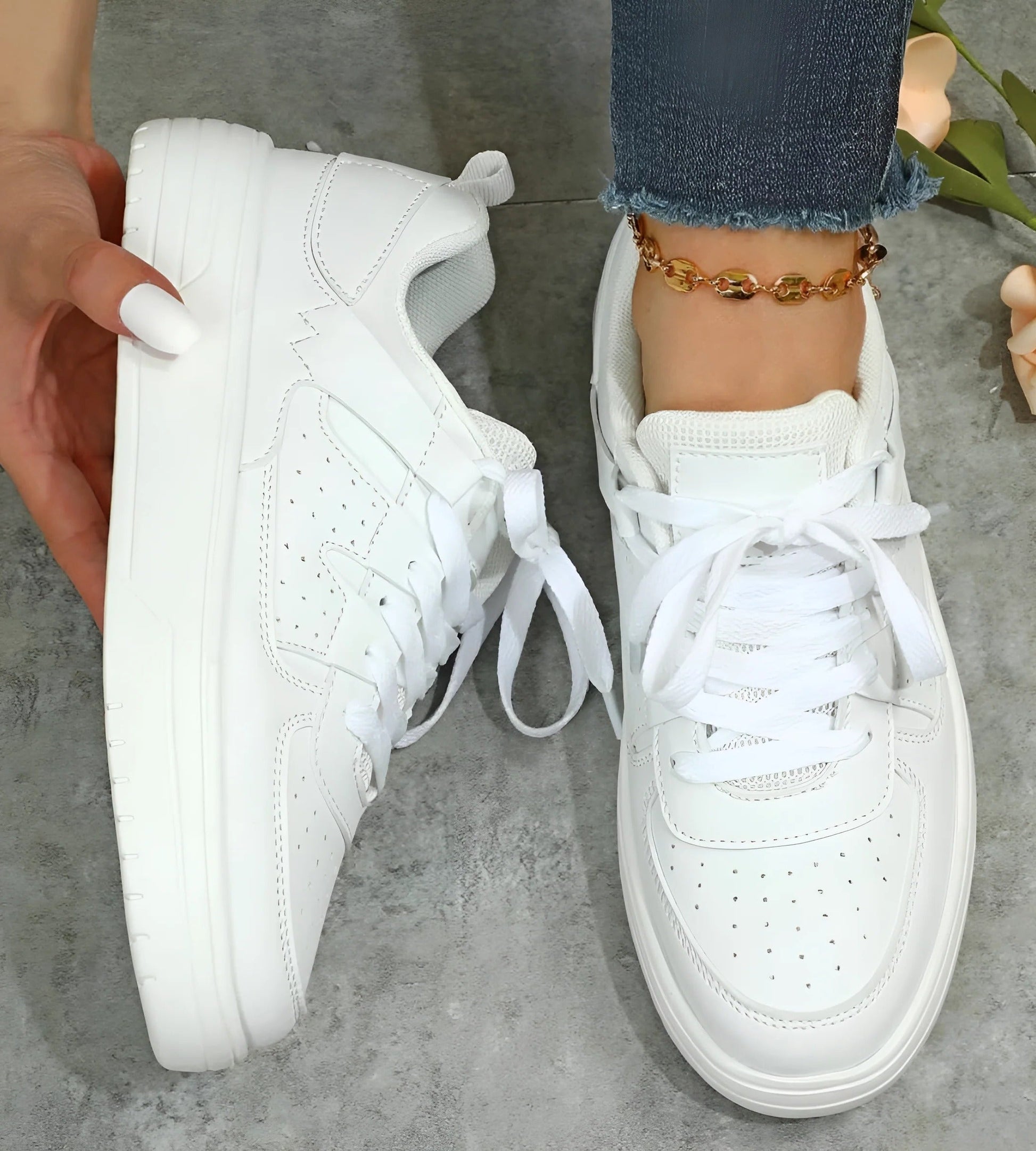 Women's low-cut lace-up sneakers in clean neutral tones, streamlined silhouette for all-day everyday comfort