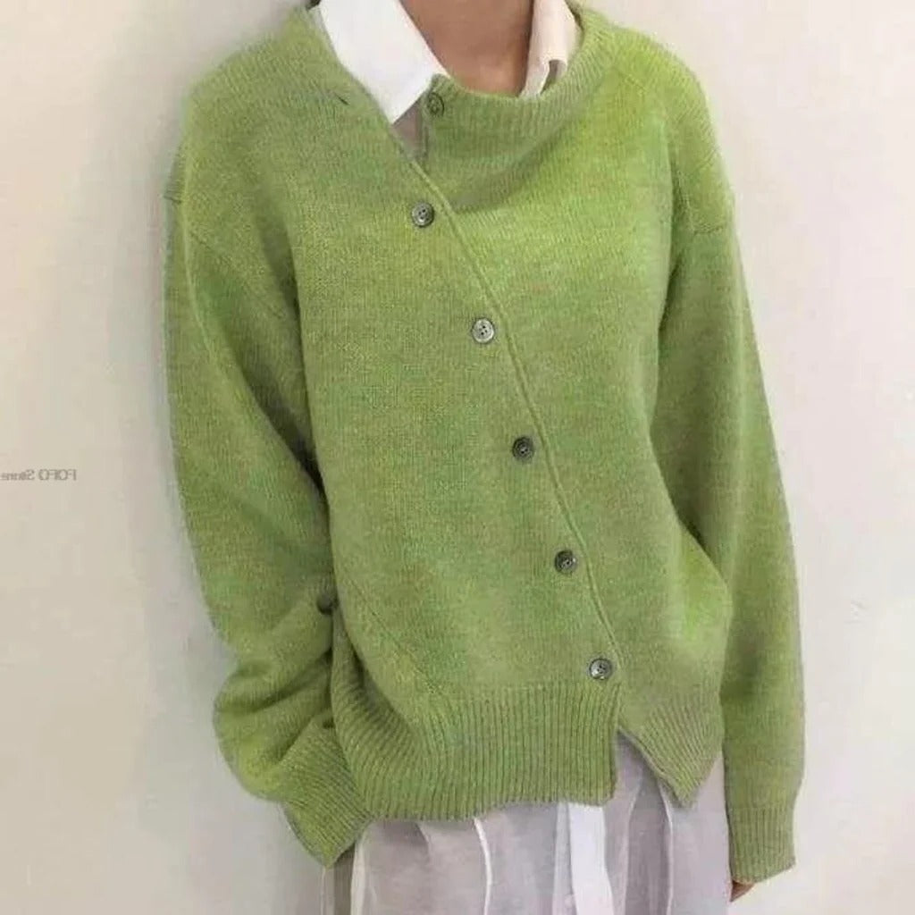 Women's mid-weight wrap jacket with asymmetrical button closure, clean structured layering essential