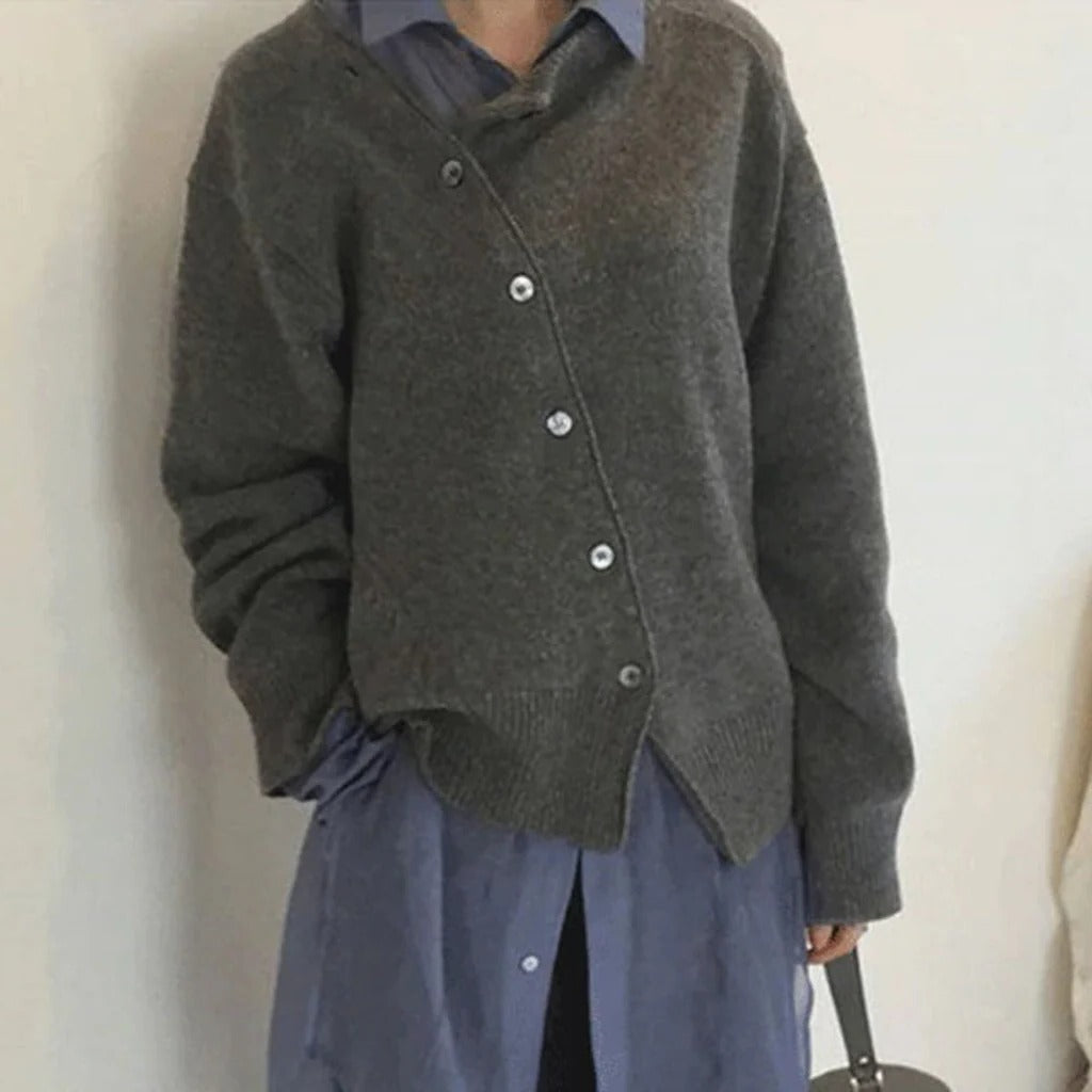 Women's mid-weight wrap jacket with asymmetrical button closure, clean layering essential