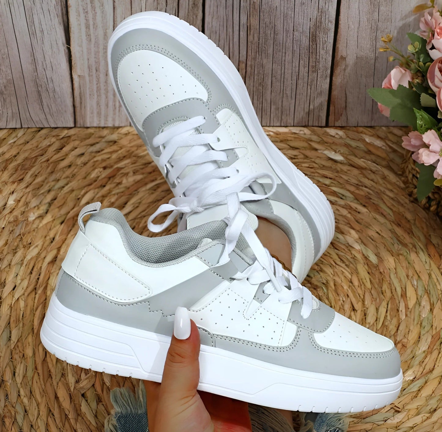 Women's low-cut lace-up sneakers in clean neutral tones, streamlined silhouette for all-day everyday comfort