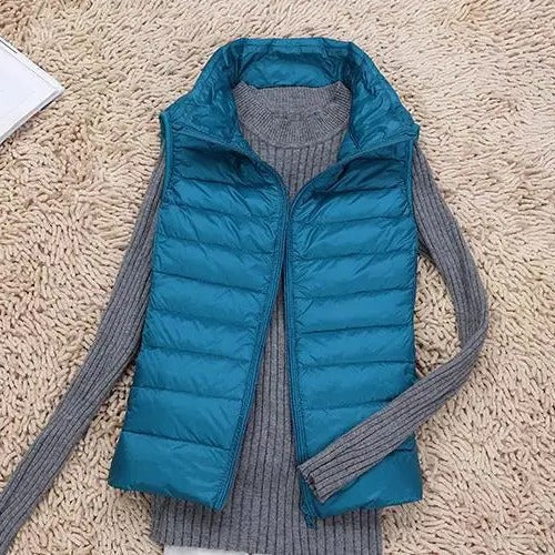 Women's ultralight slim vest sleek silhouette warm layering piece no bulk everyday wear