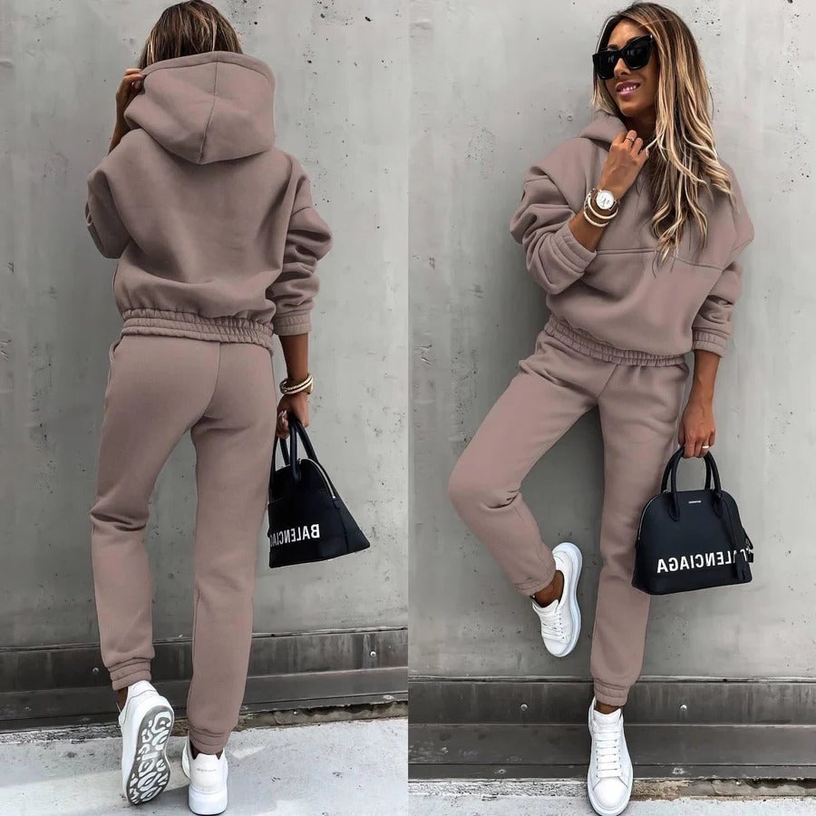 Gray lounge tracksuit set featuring oversized hoodie and slim tapered joggers for travel comfort