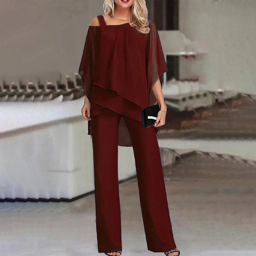 Women's open shoulder full-length jumpsuit with structured silhouette and contemporary cut