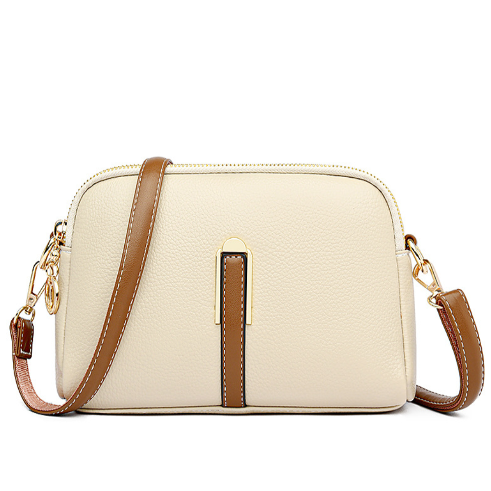 Elaine black vegan leather crossbody bag with gold-tone zipper and adjustable strap