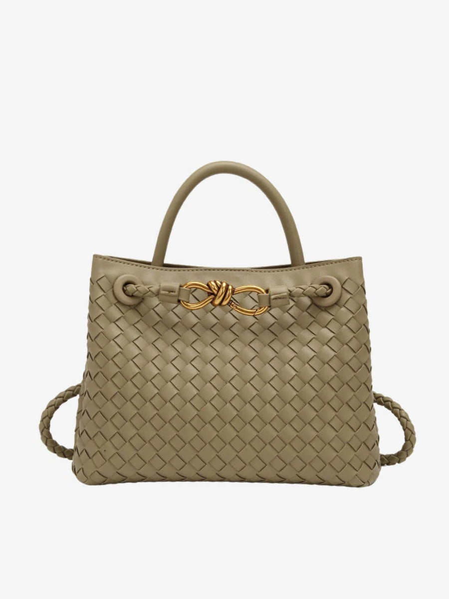 Structured black woven tote bag with gold knot accent and dual carry straps for professionals