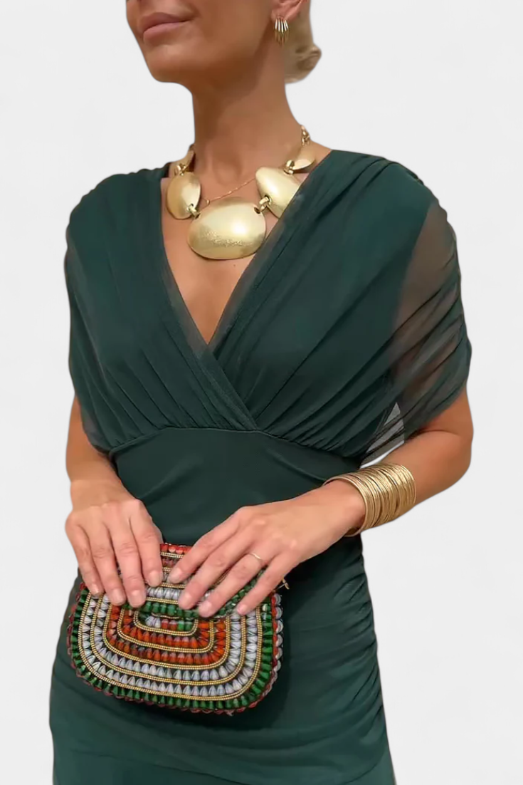 Women's off-shoulder draped midi dress with fitted bodice and flowing skirt for elegant evenings