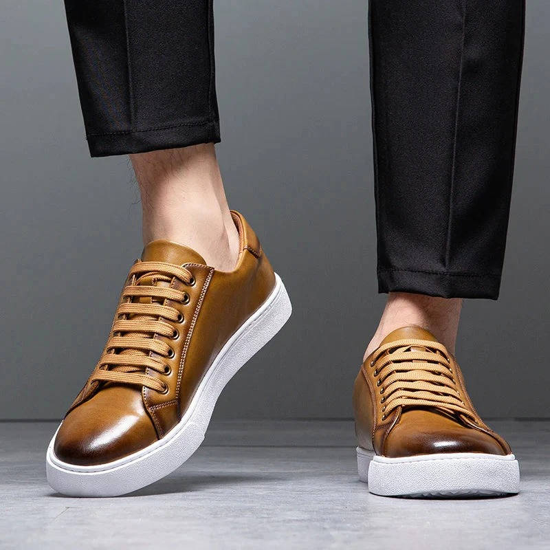 Men's low-top genuine leather sneakers in classic white, sleek everyday style with premium breathable upper
