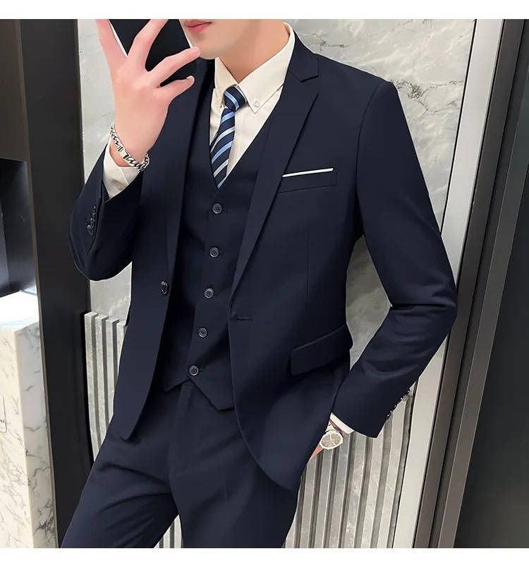 Men's slim fit three-piece suit in classic navy with matching vest, jacket, and tapered pants