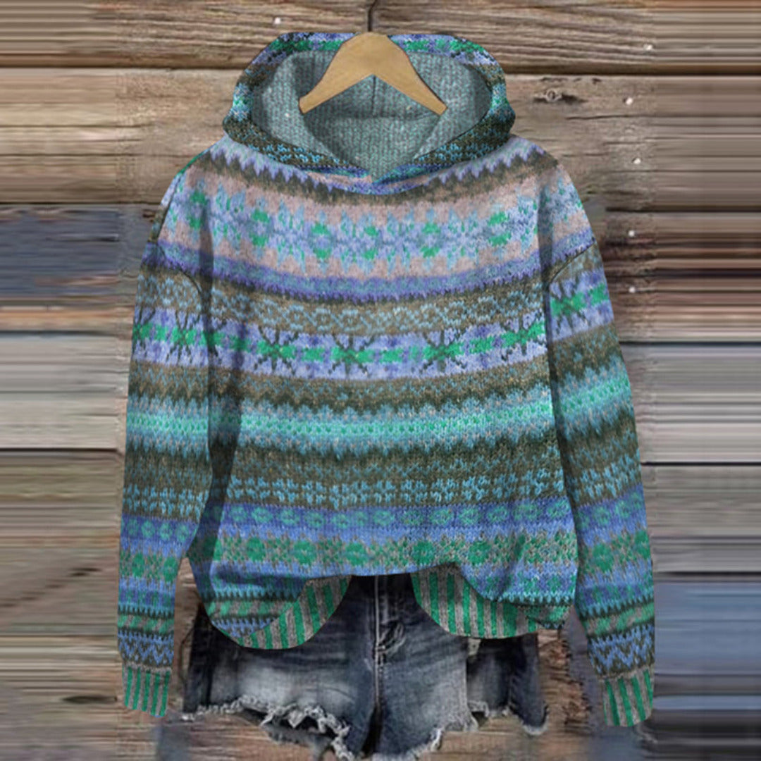 Women's relaxed fit pullover hoodie in cozy knit fabric with ribbed cuffs for effortless layering