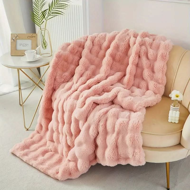 Light blue plush faux fur throw blanket with chunky minimalist double-sided design for couch or bed