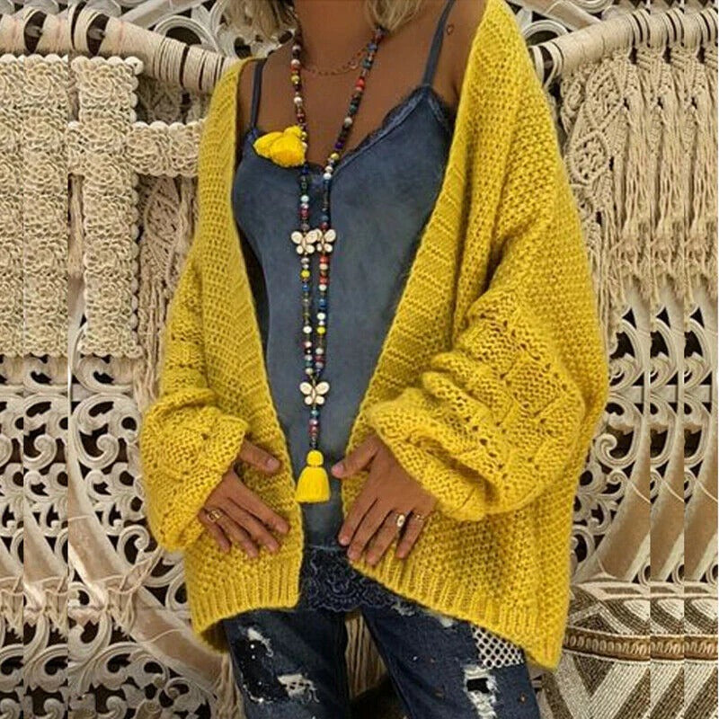 Women's oversized open-front chunky knit cardigan in neutral cozy layering style with wide sleeves