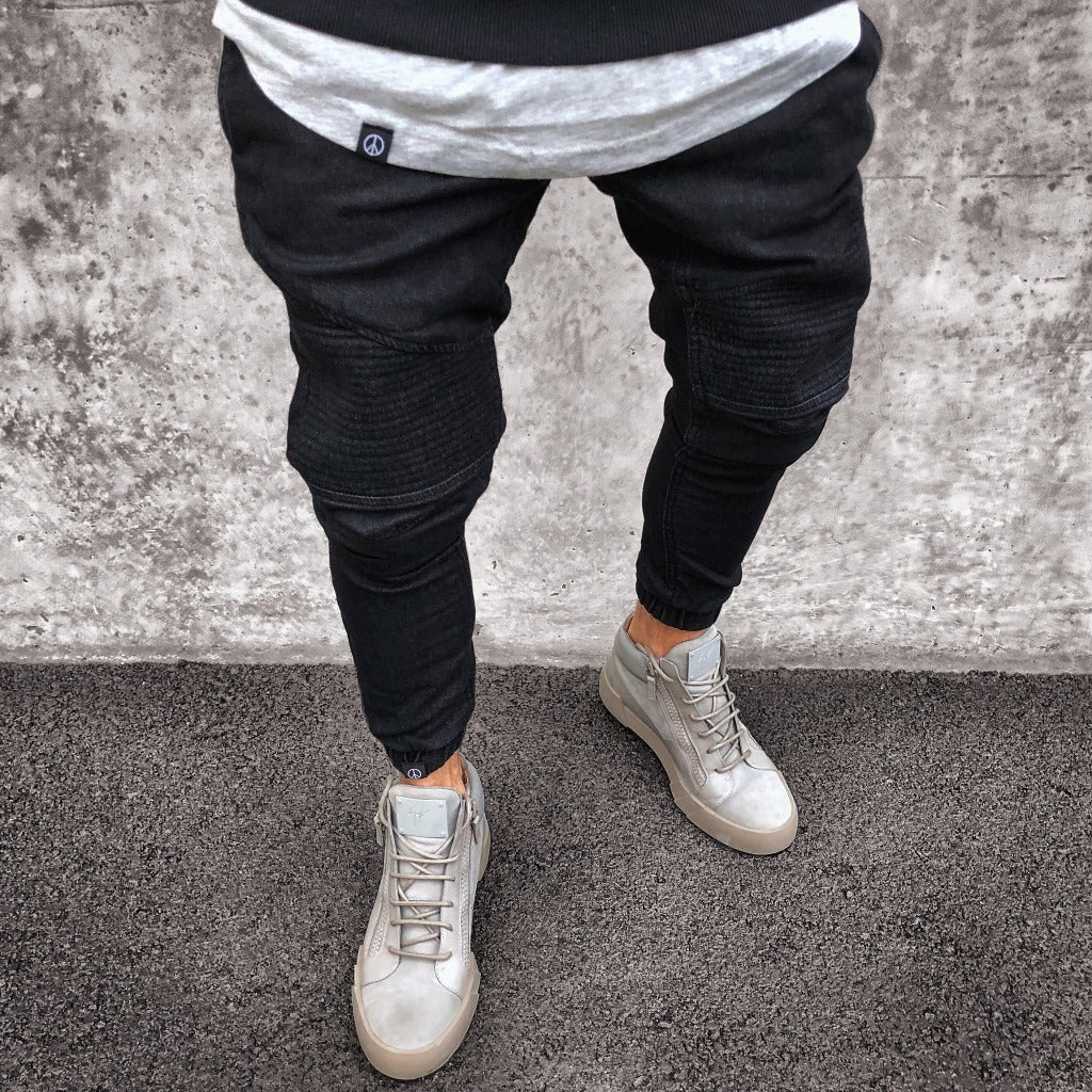 Men's slim fit gray joggers with elastic waist and distinctive ribbed knee detailing for active wear
