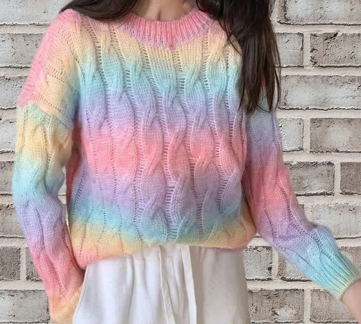 Women's relaxed-fit cable knit sweater, soft warm neutral tone, long sleeves, casual everyday style