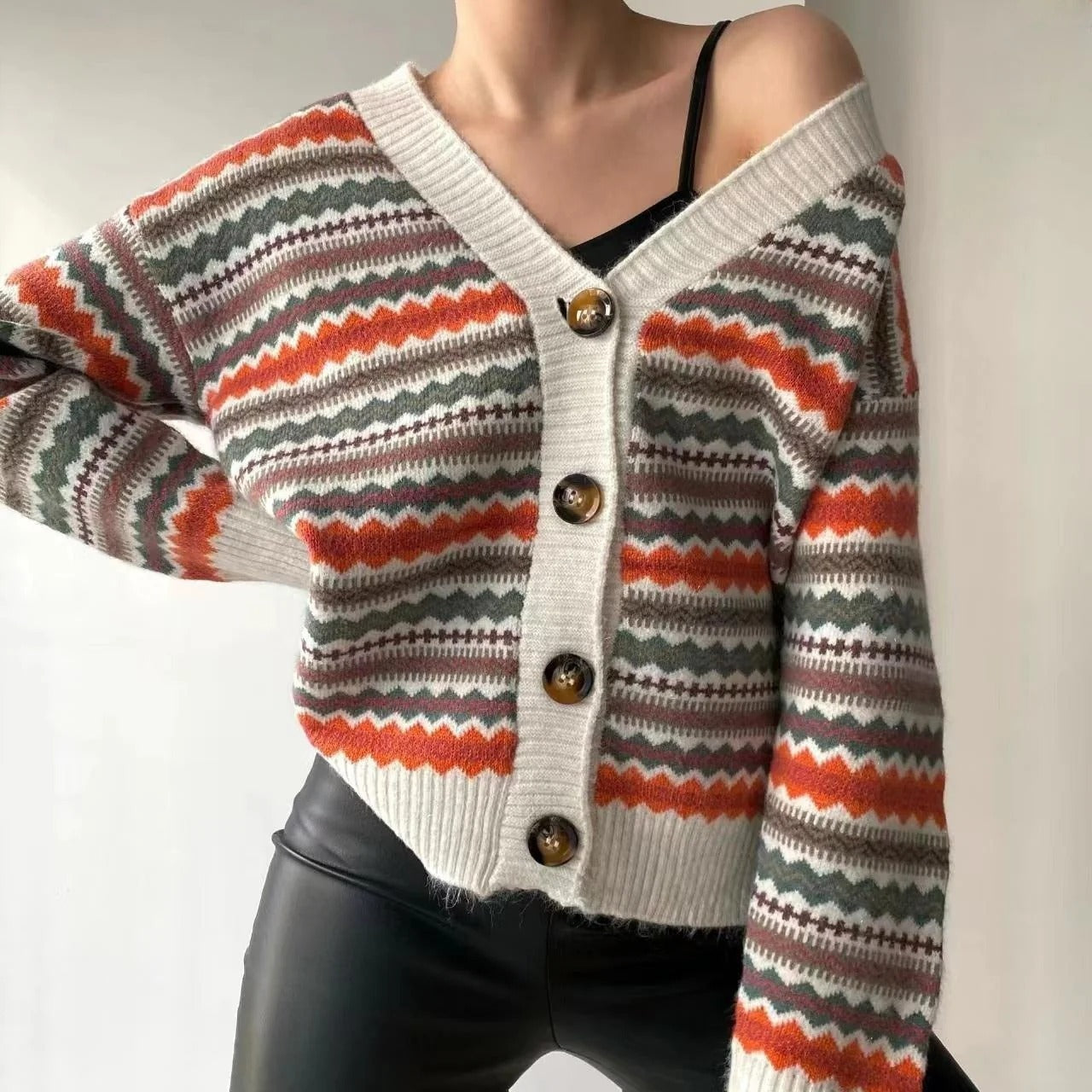 Women's relaxed-fit knit cardigan with V-neck, button closure, and patterned design for effortless style
