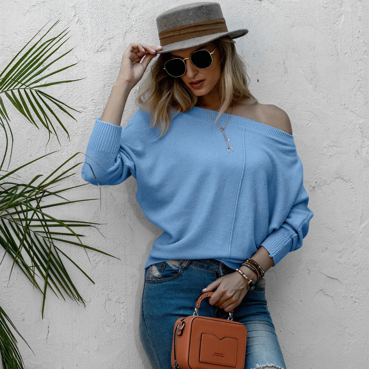Women's oversized off-shoulder knit sweater with wide sleeves, soft wool-feel fabric, relaxed fit
