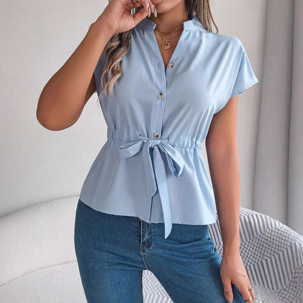 Women's tailored cotton blouse with waist tie, button-front closure, and short sleeves for modern professionals