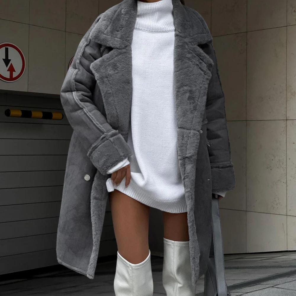 Women's oversized full-length plush faux fur coat with wide lapel and button front closure