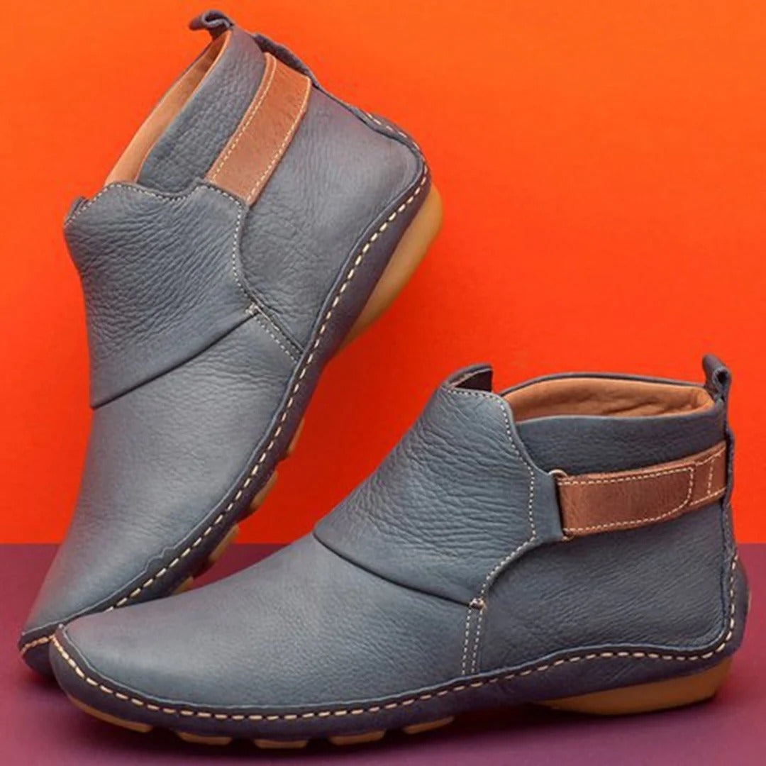 Women's black PU leather ankle boots with rounded toe and refined strap detail for casual everyday style