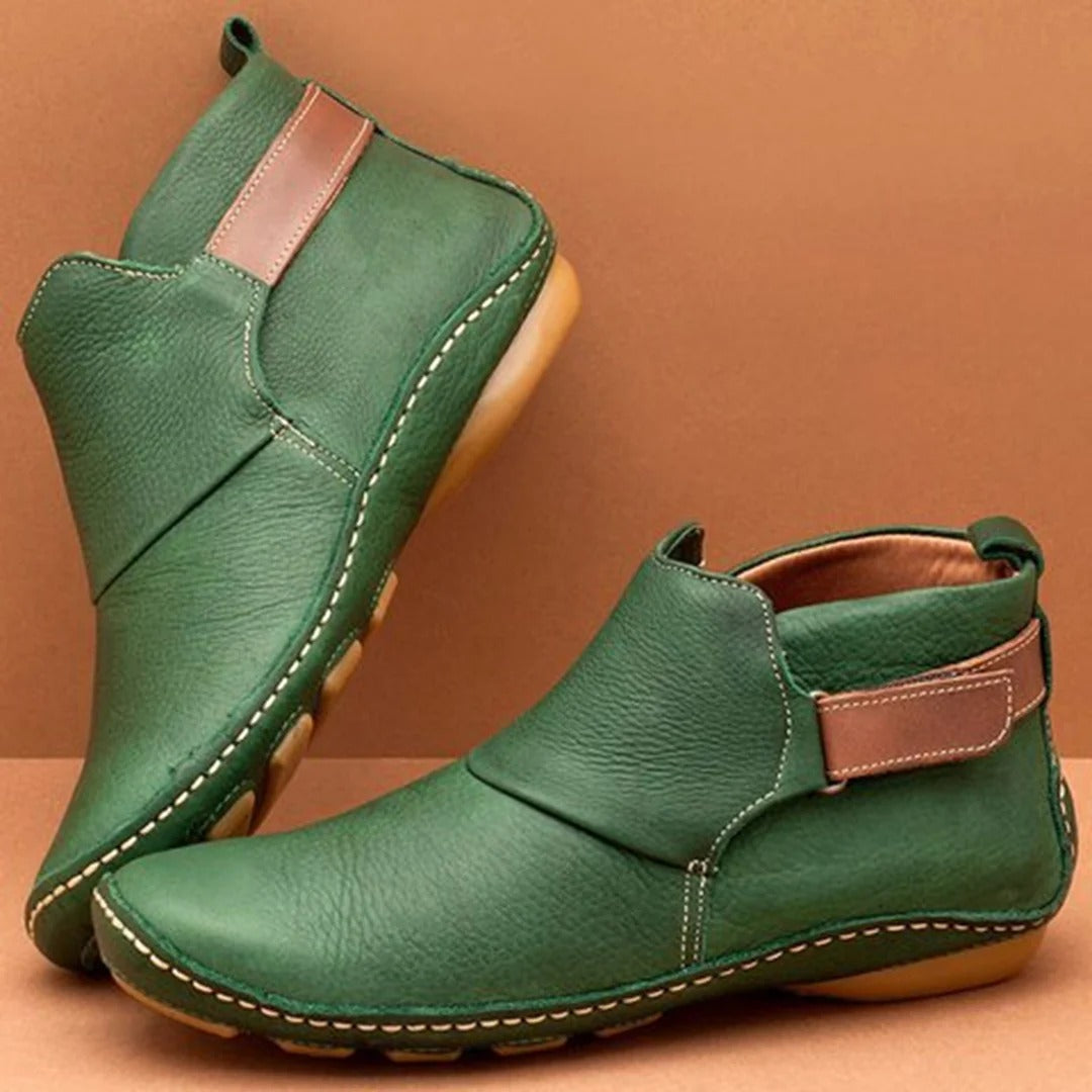 Women's black PU leather ankle boots with rounded toe and refined strap detail for casual everyday style