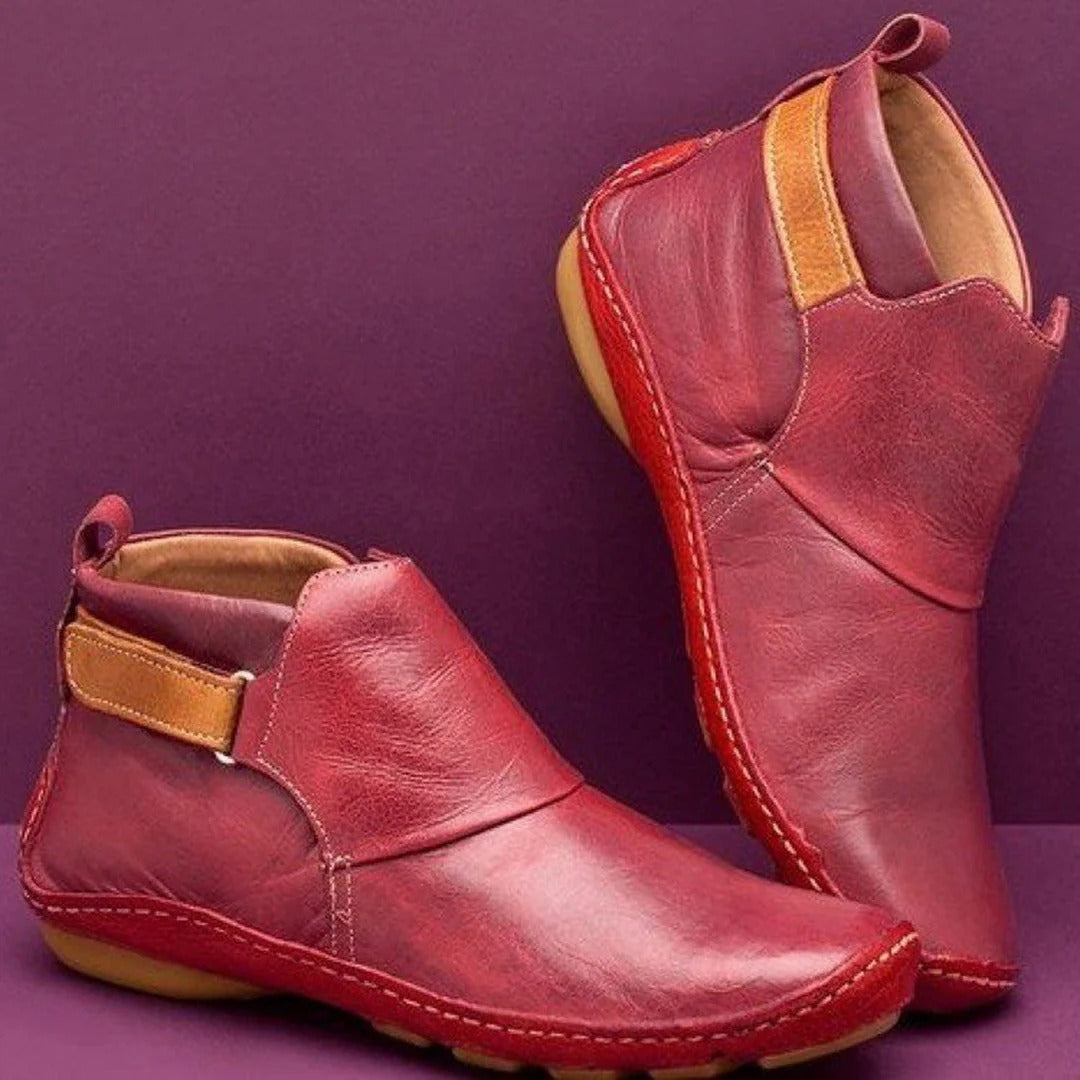 Women's black PU leather ankle boots with rounded toe and refined strap detail for everyday casual style