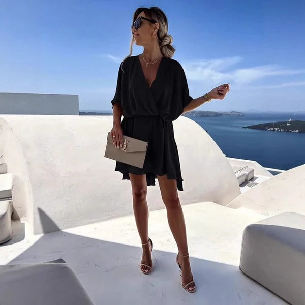 Women's wrap dress deep V-neck cinched waist flutter hem summer style versatile chic silhouette