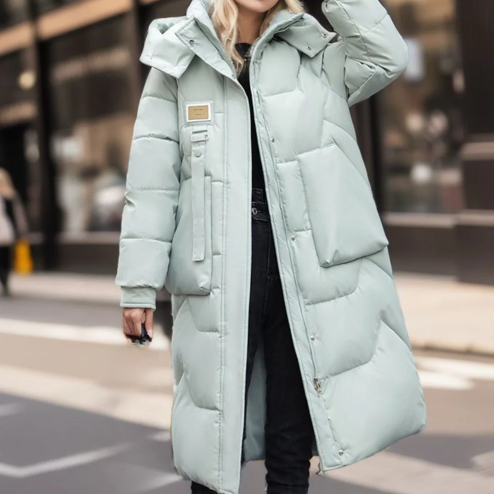 Women's oversized full-length quilted hooded coat in neutral tone, water-resistant with cozy warmth