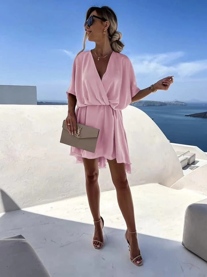 Women's wrap dress deep V-neck cinched waist flutter hem summer style versatile chic silhouette